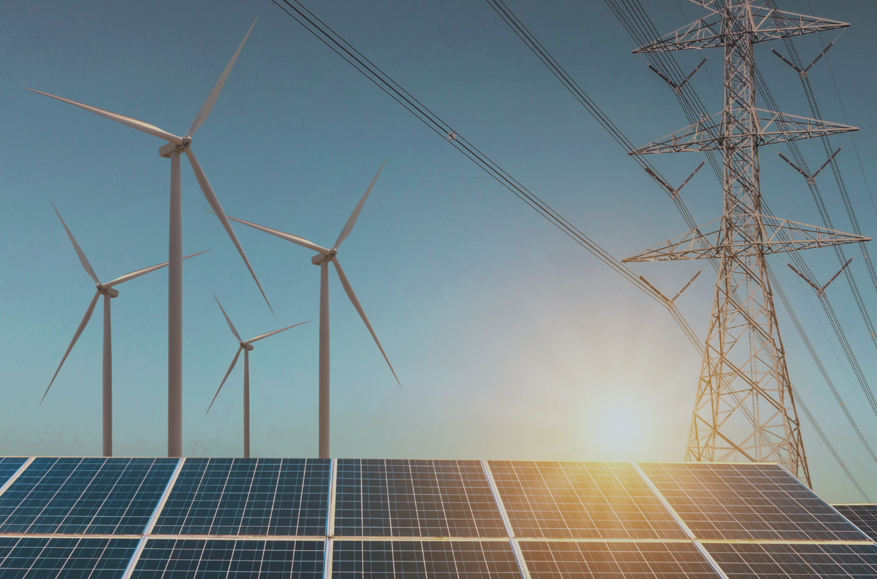 photo of solar panels, wind turbines, and power lines against sky with sunrise