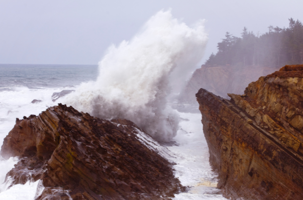 Image of wave crashing in the Oregon Coast