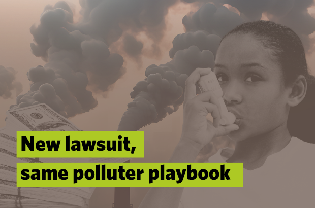 A picture of a child using her inhaler with smoke stacks in the background.
