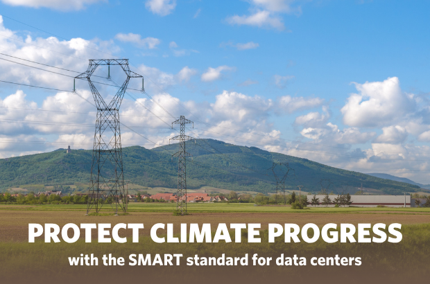 High-voltage transmission lines cross agricultural fields with hills and blue sky in the background, illustrating the energy infrastructure that supports the Northwest's clean energy transition.