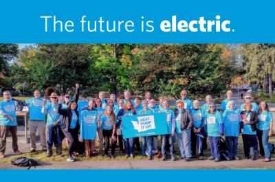 group photo with heat pump it up tee shirts and heat pump it up sign