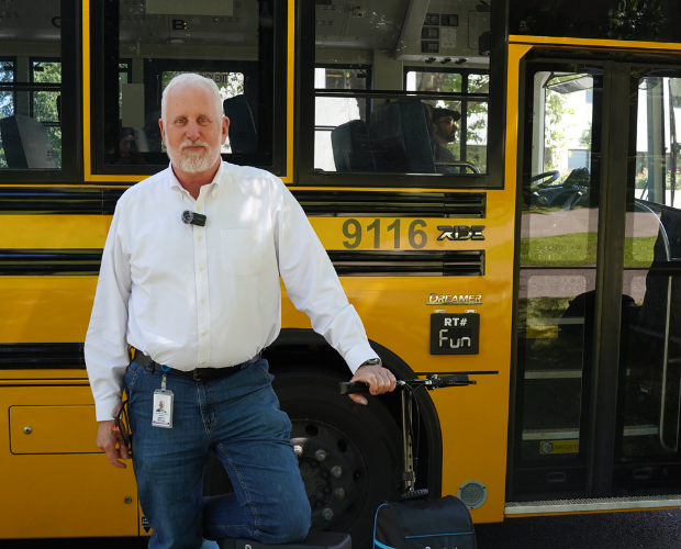 Rep. Mark Gamba standing outside of the electric school bus during our clean bus and truck advocacy day.