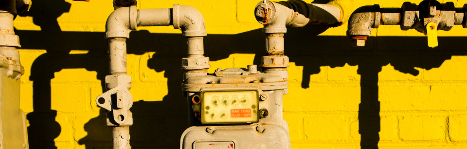 image of a gas meter on a yellow wall