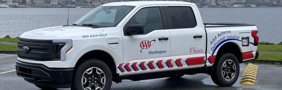 Electric pickup truck with AAA logos