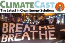 woman holding sign saying "breathe breathe" 