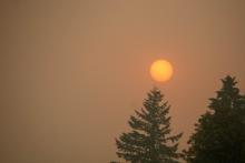 Sunset over a smoky sky