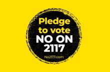 no on 2117 campaign logo, white text in black circle over gold background