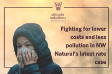 a boy holds a mask to his face