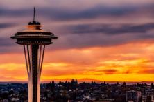 top of seattle space needle set against sunset 
