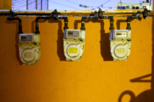 image of a gas meter on a yellow wall