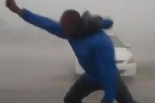 Meteorologist in a hurricane
