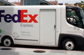 Electric Fedex mail truck sits parked